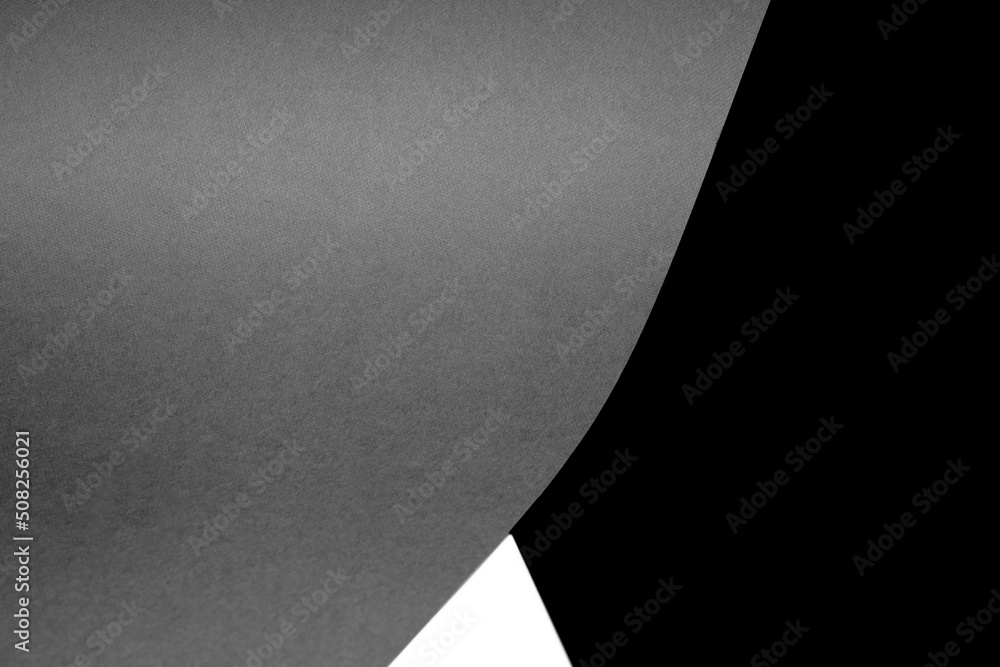 Black white and grey papers forming triangle shape textured background Black white and grey papers forming triangle shape textured background