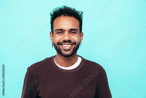 Obraz na plátně Closeup portrait of handsome smiling hipster model