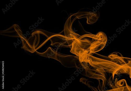 Fototapeta Naklejka Na Ścianę i Meble -  Yellow smoke abstract on black background, darkness concept