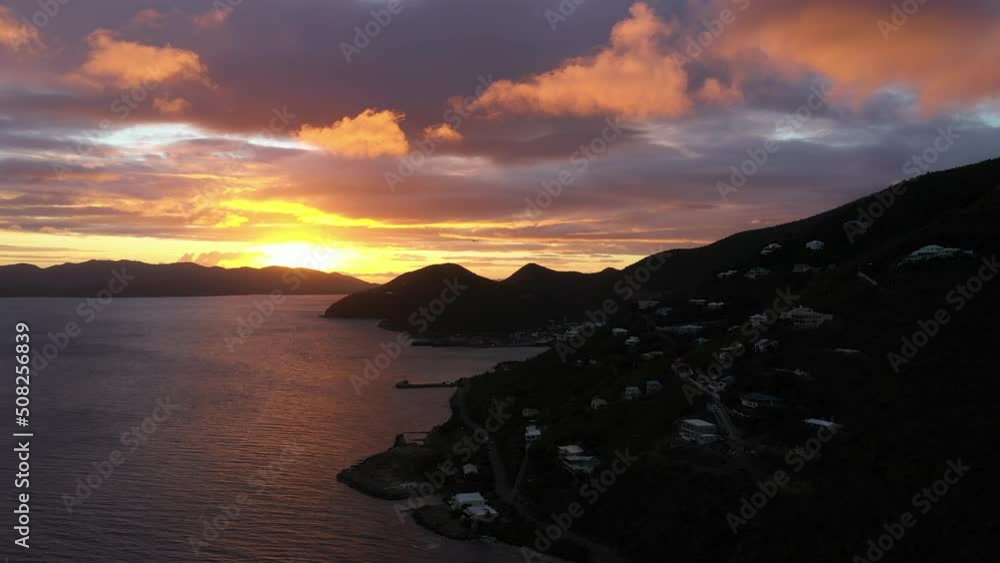 British Virgin Islands - Aerial view of a beautiful sunset in Tortola. Flying forward. British Virgin Islands - Aerial view of a beautiful sunset in Tortola. Flying forward.