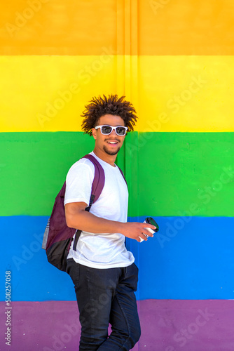young afro with gay pride flag