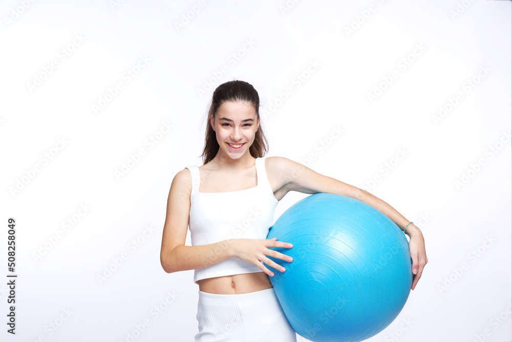Young beautiful girl doing yoga poses, studio white background Young beautiful girl doing yoga poses, studio white background