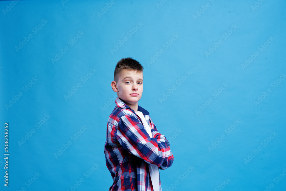 Happy young teenage boy, making confident face Happy young teenage boy, making confident face