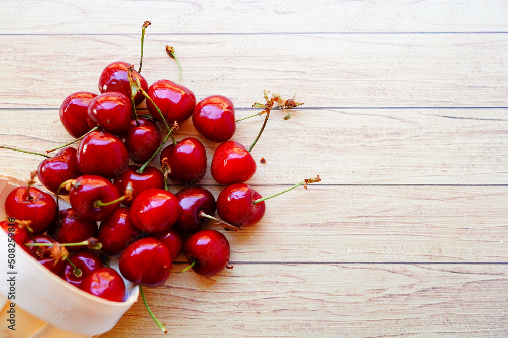 fresh cherries on wooden background with copy space fresh cherries on wooden background with copy space