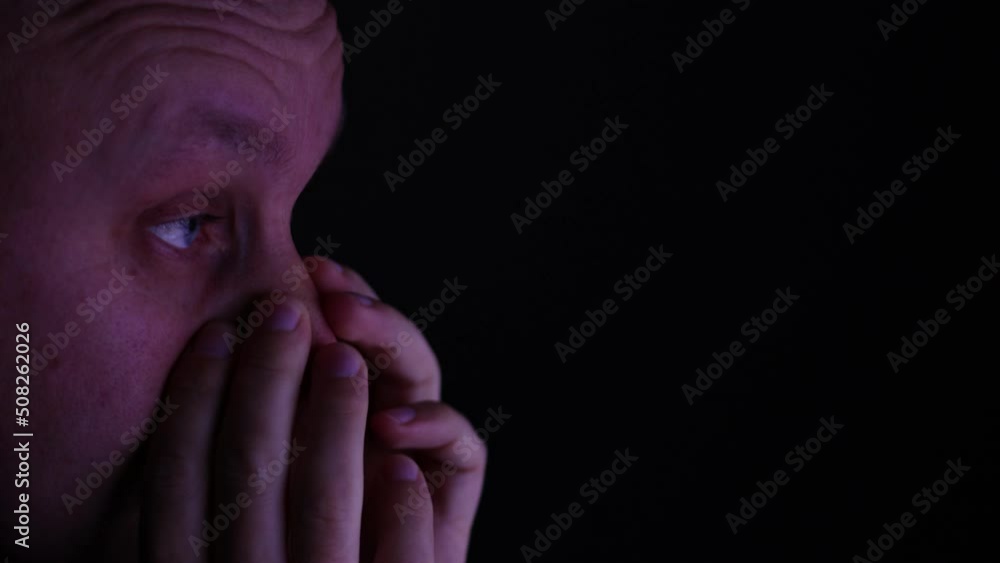 Tired man rubbing his eyes after long working day on computer. Exhausted guy doing remote work all day and night. Overwork concept Tired man rubbing his eyes after long working day on computer. Exhausted guy doing remote work all day and night. Overwork concept