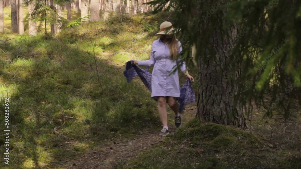 Charming handmaiden taking a stroll in the woods as a break Charming handmaiden taking a stroll in the woods as a break