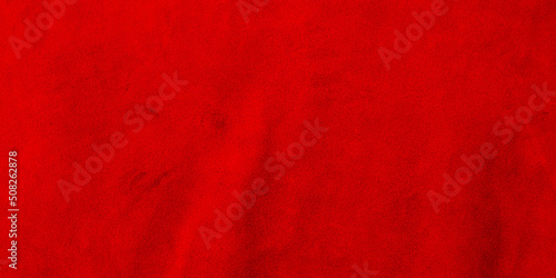 Red matte background of suede. Velvet texture of seamless leather. Red suede texture.