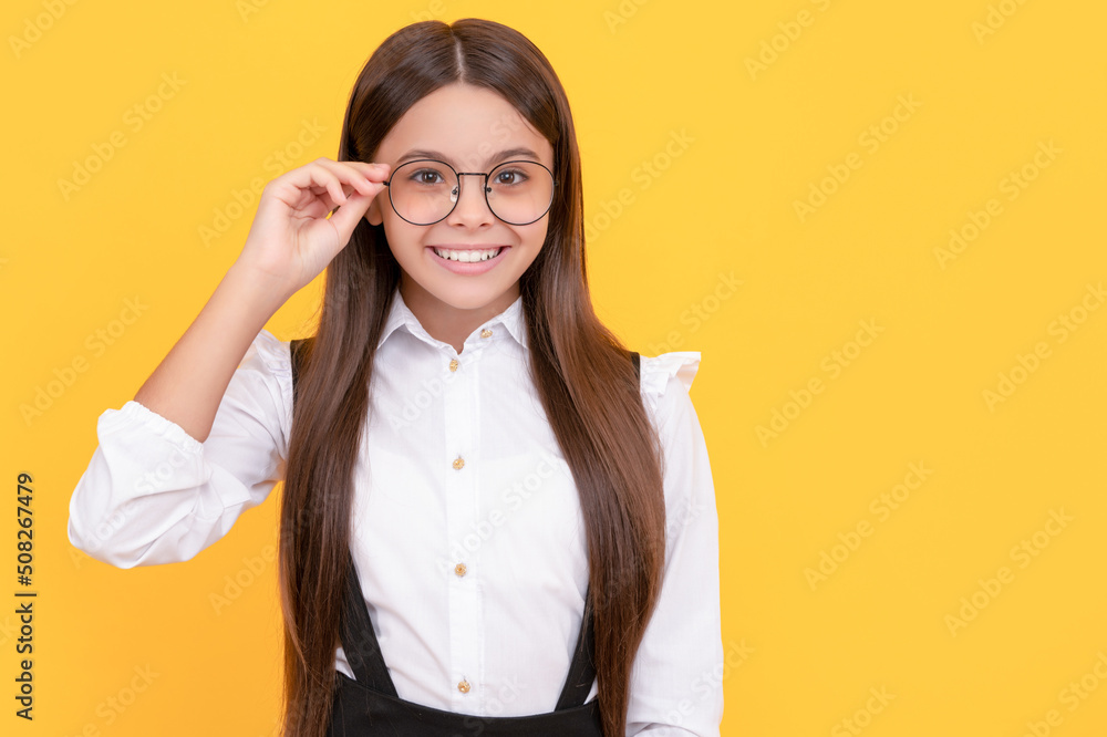 smiling teenage girl look through eyeglasses. vision acuity. eyesight. vision correction.