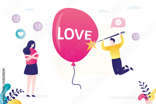 Man pierces balloon with love inscription with needle. Couple breaks up due to frequent quarrels, misunderstandings