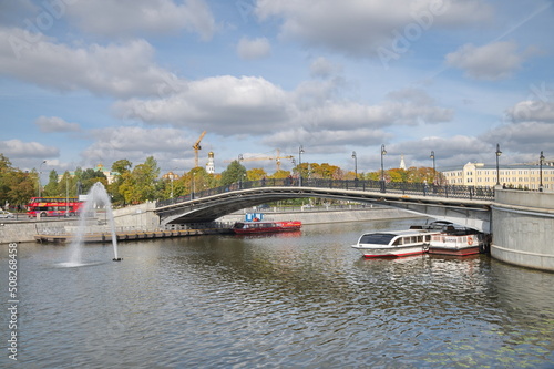 Moscow, Russia - September 29, 2021: Autumn view of the Luzhkov (Tretyakov) bridge and Drainage Canal on a sunny day  