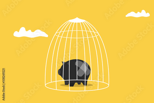 Economy while Coronavirus lockdown, piggy bank in cage.