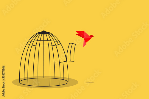 Origami paper bird escape out of birdcage, freedom concept
