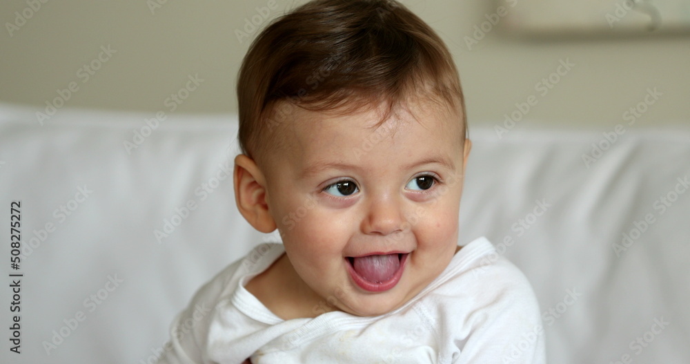 Cute baby infant boy portrait face smiling. Adorable beautiful sweet toddler child