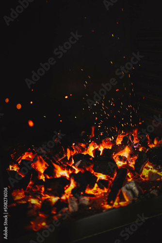 Image of burning coals in a restaurant grill