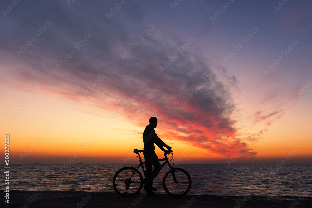 Fototapeta premium Biking in Paradise: Sunset Beach Ride