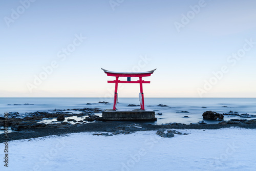 Long exposure view of Konpira shrine torii gate in the snow photo