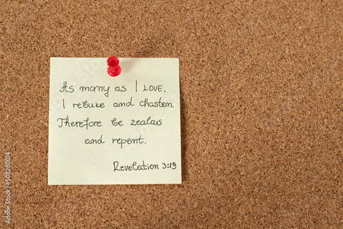 Photos A handwritten verse note from the Holy Bible Book of Revelation 3: 19 on a pinning board