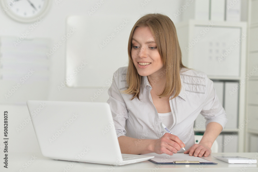 young business woman with laptop in office young business woman with laptop in office