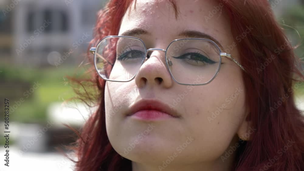 Young redhead ukrainian teen girl in glasses on city street Young redhead ukrainian teen girl in glasses on city street