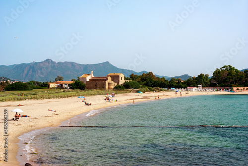 Sardegna, spiaggia di Nora e antica chiesetta di Sant'Efisio sullo sfondo, Italia, Europa photo
