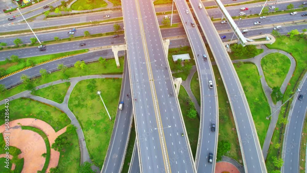 4K : Top view of Highway road junctions. The Intersection freeway road overpass the eastern outer ring road. Aerial view from a drone. Nonthaburi, thailand.
4K : Top view of Highway road junctions. The Intersection freeway road overpass the eastern outer ring road. Aerial view from a drone. Nonthaburi, thailand.