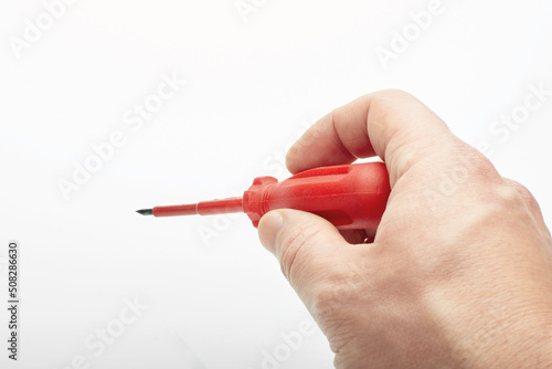 screwdriver in hand on white background