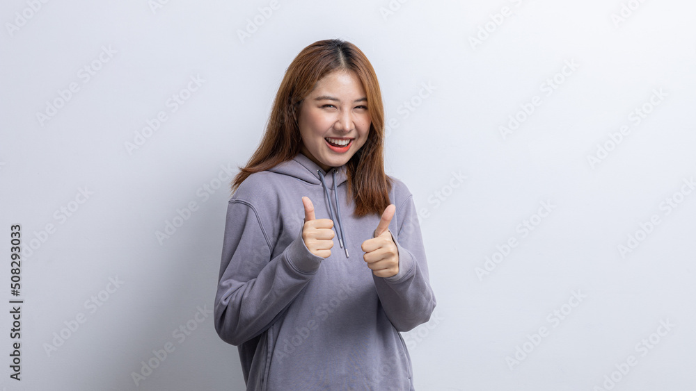 Portrait of beautiful Asian woman doing cheerful pose on isolated background, portrait concept used for advertisement and signage, isolated over white background, copy space. Portrait of beautiful Asian woman doing cheerful pose on isolated background, portrait concept used for advertisement and signage, isolated over white background, copy space.