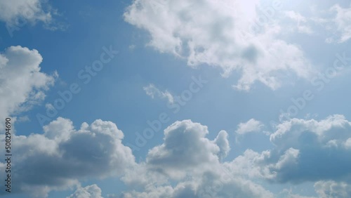 Clouds moves in the blue sky. Clouds running across brilliant blue sky. Natural abstract background. photo