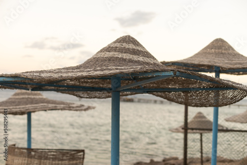 Sun loungers with an umbrella on the beach.