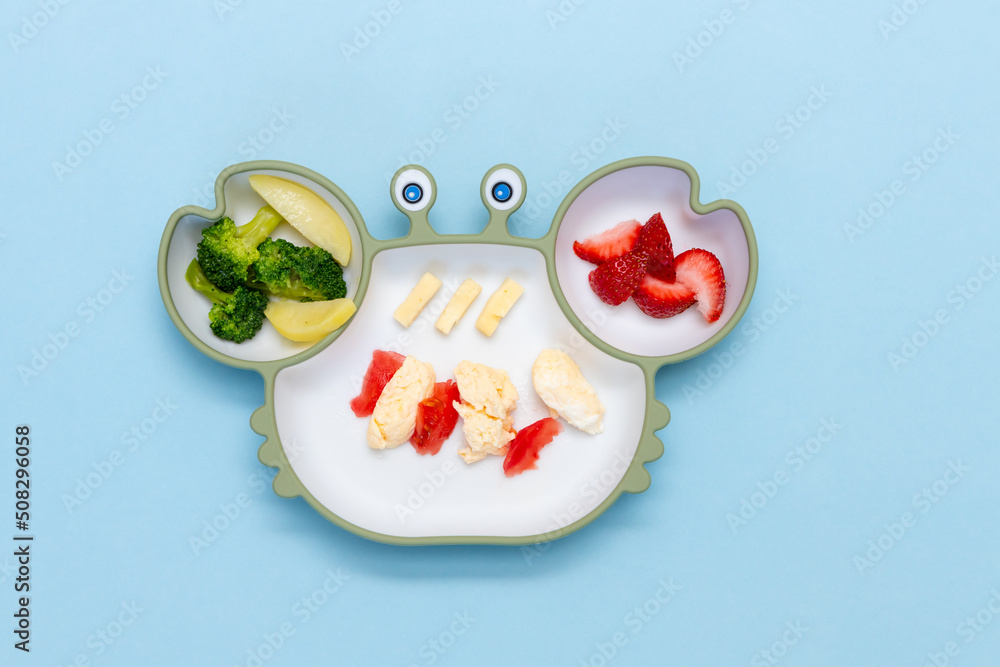 Children's tableware. Baby Silicon plate with mixed vegetable. Healthy nutrition for kid, self feeding. Soft eco plastic tableware. Children's tableware. Baby Silicon plate with mixed vegetable. Healthy nutrition for kid, self feeding. Soft eco plastic tableware.