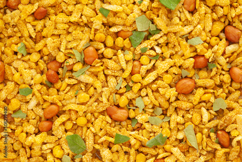 Crunchy Diet Mixture full-frame wallpaper, made with Puffed Rice, Corn Flakes, and Curry leaves. Indian spicy snacks (Namkeen) photo