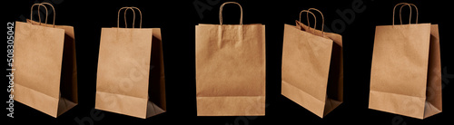 A brown paper bag in different angles, isolated on a black background.