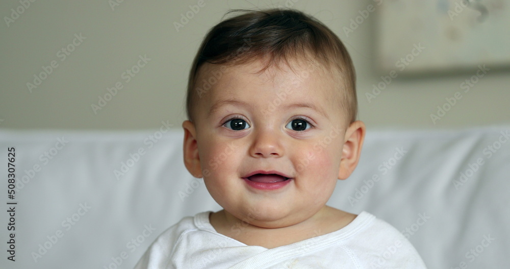 Cute baby toddler child, sweet infant baby boy portrait looking at camera Cute baby toddler child, sweet infant baby boy portrait looking at camera