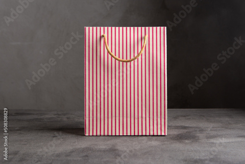 Blank paper carrier bag with handles for shopping - disposable bag, recycling concept