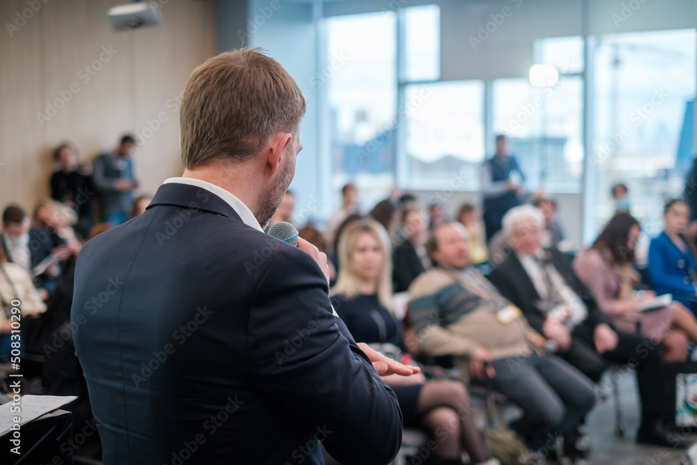 Business speaker talking to audience Business speaker talking to audience