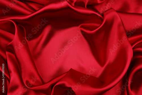Closeup of rippled red silk fabric 