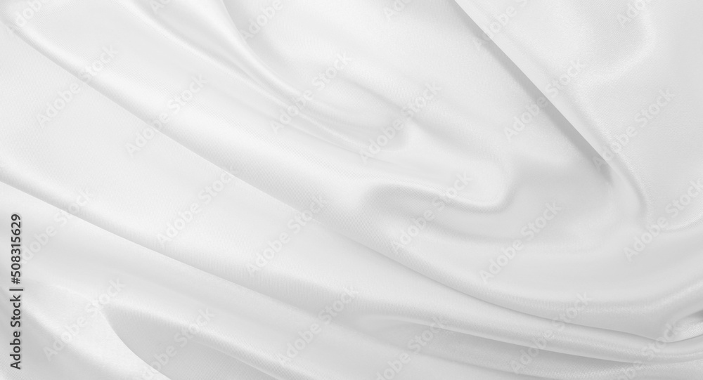 Smooth elegant white silk or satin luxury cloth texture as wedding background. Luxurious background design Smooth elegant white silk or satin luxury cloth texture as wedding background. Luxurious background design