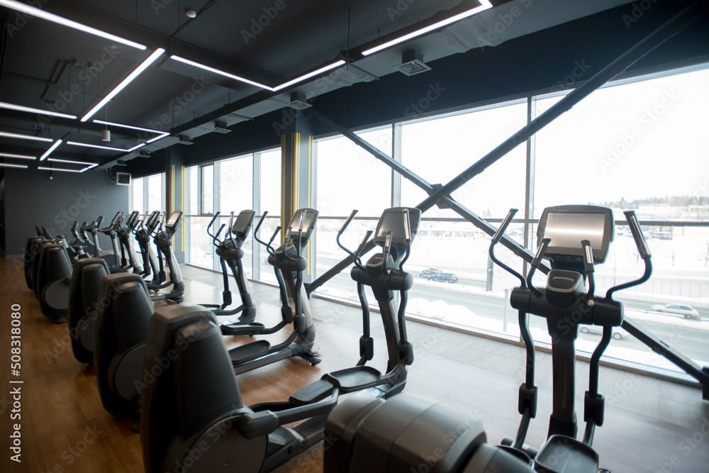 Sport gym interior with treadmill equipment in the morning Sport gym interior with treadmill equipment in the morning