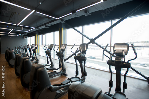 Sport gym interior with treadmill equipment in the morning