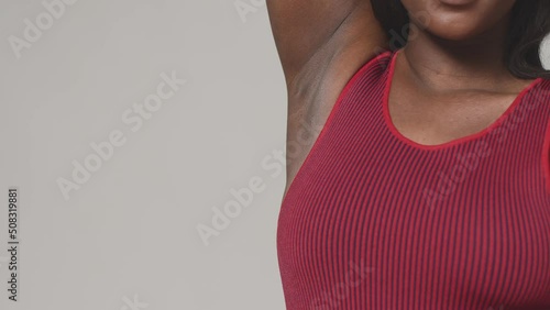 Happy african american woman showing armpit. Copy space. Hair removal and depilation. Body positive concept. ProRes