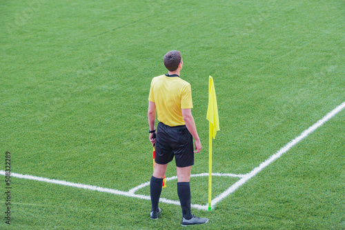 Referee from the sidelines of a soccer game.