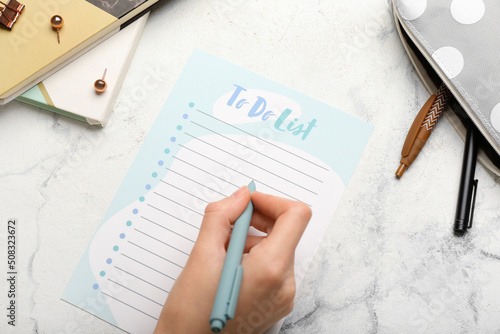 Female hand with to-do list...
