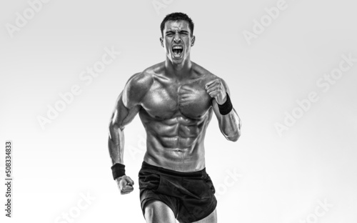 Runner concept. Athlete sprinter running on light background. Fitness and sport motivation. Trail run. © Mike Orlov