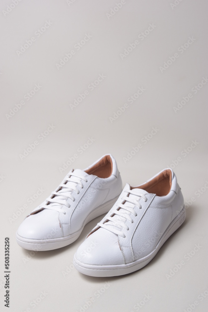 white leather sneakers isolated on white background white leather sneakers isolated on white background