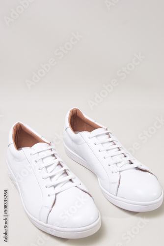 white leather sneakers isolated on white background