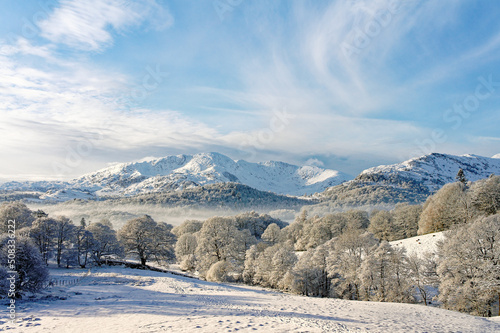 Lake District National Park, Cumbria, England, UK. Winter landscape. S.W. over Langdale to Wetherlam mountain from Loughrigg photo