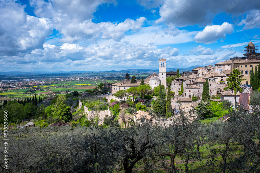 Wide panorama of the ancient houses and countryside surrounding the city of Assisi (Umbria Region, central Italy). Is world famous as birthplace of St. Francis, Italy's christian Patron.