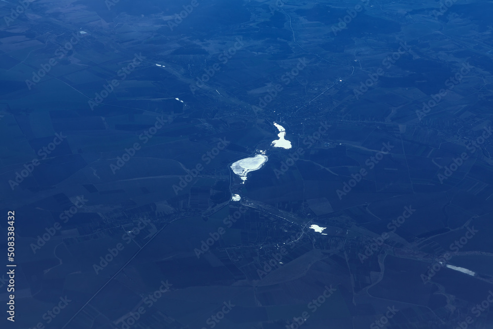 Aerial view of blue terrain . Navigation over the Earth Aerial view of blue terrain . Navigation over the Earth