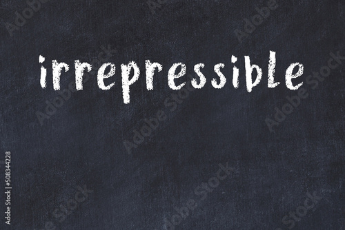 College chalk desk with the word irrepressible written on in