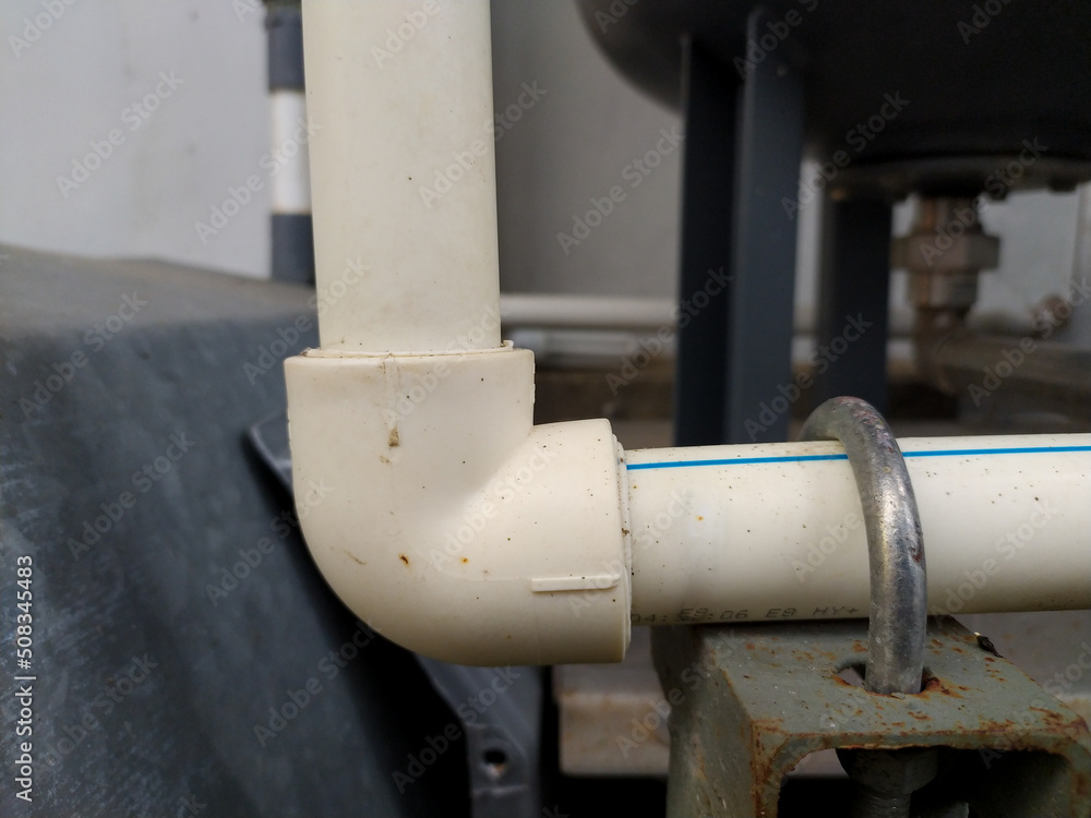 ppr pipe elbow joint mounted u bolt reinforcement. Stock Photo Adobe Stock